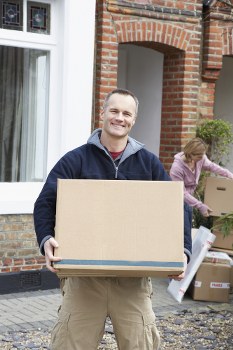 Professional movers packing household items in Kennington
