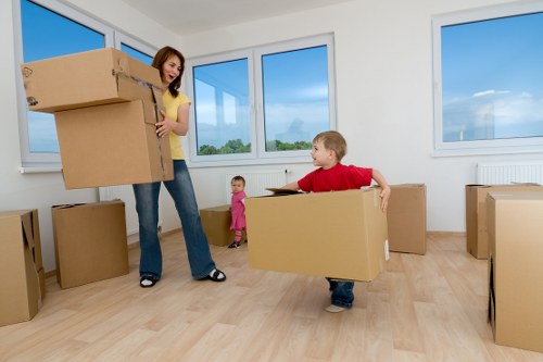 Team unpacking and setting up furniture in a new home